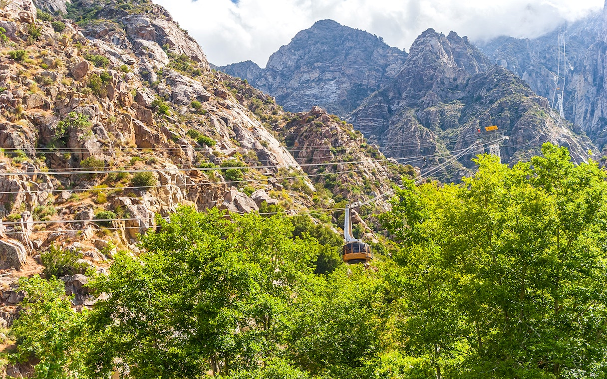 Tramway ascending rocky mountains at Palm Springs Aerial Tramway.