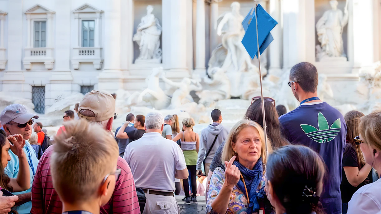 Tour group at Trevi Fountain during guided walking tour in Rome.
