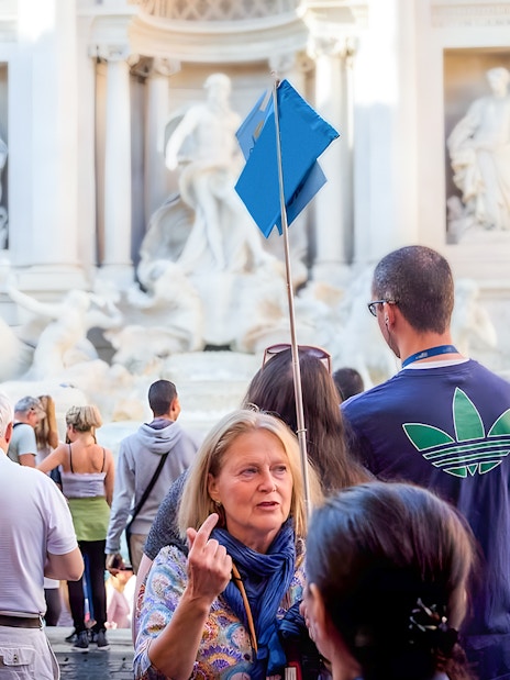 Tour group at Trevi Fountain during guided walking tour in Rome.