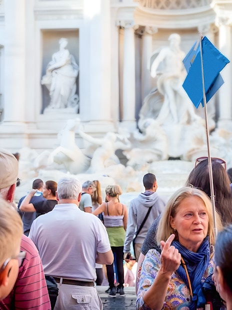Tour group at Trevi Fountain during guided walking tour in Rome.