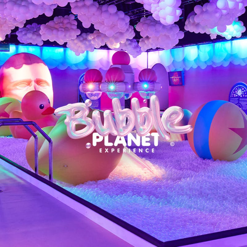 Interactive bubble-themed exhibit at Bubble Planet Atlanta with colorful inflatables.