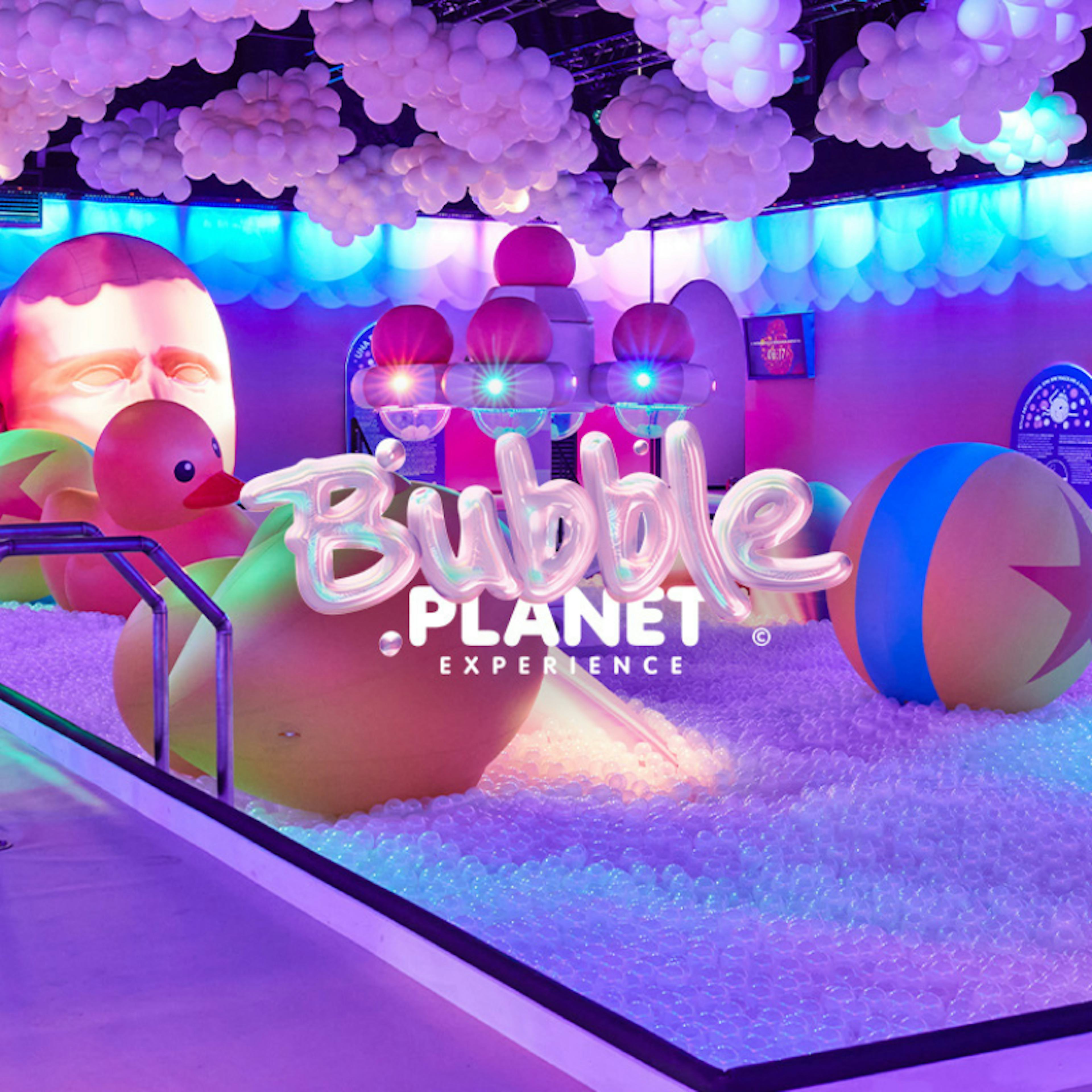 Interactive bubble-themed exhibit at Bubble Planet Atlanta with colorful inflatables.