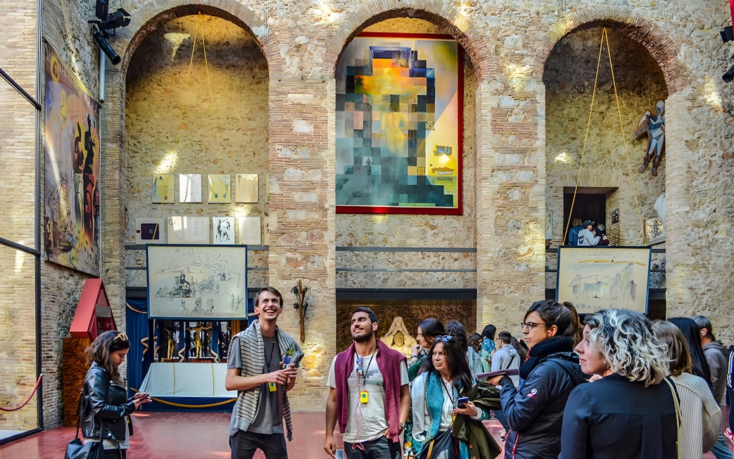 Visitors inside the courtyard of the Dalí Theatre and Museum, Figueres, Catalonia, Spain.