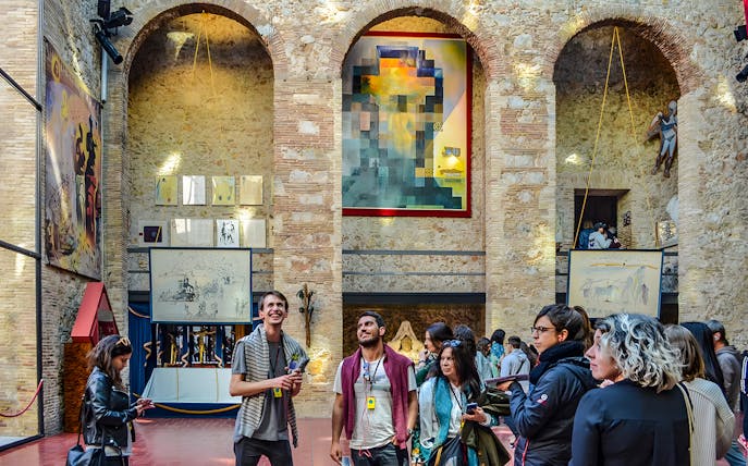 Visitors inside the courtyard of the Dalí Theatre and Museum, Figueres, Catalonia, Spain.