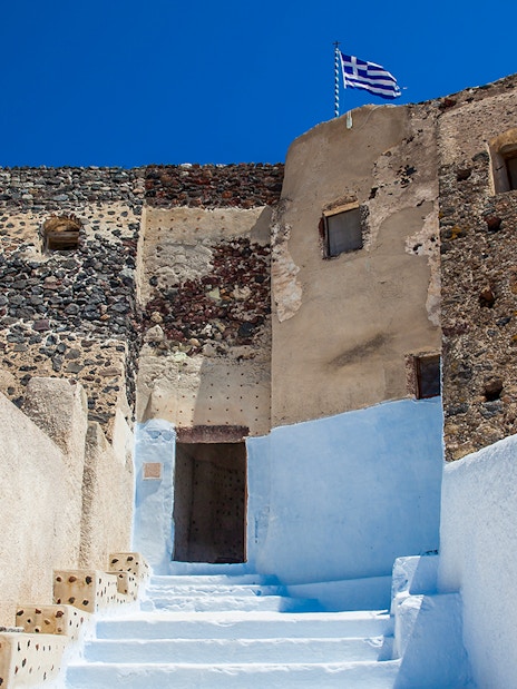 Stone walls and steps leading to the Ruins of the Castle of Akrotiri, Greece.