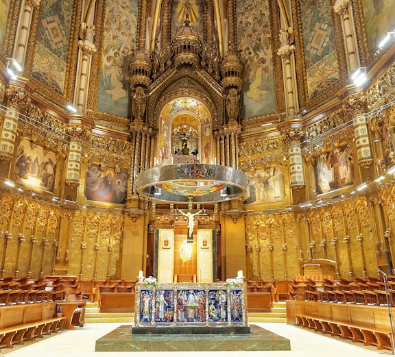 Santa Maria de Montserrat Abbey interior with ornate altar, Barcelona, Spain.