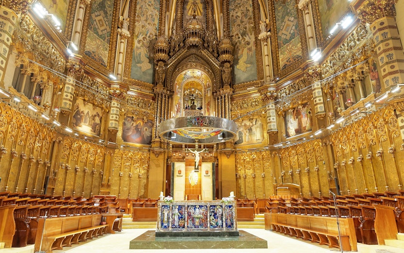 Santa Maria de Montserrat Abbey interior with ornate altar, Barcelona, Spain.