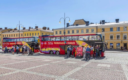 Guests boarding a red double-decker bus during Helsinki Hop-on Hop-off Bus Tour.