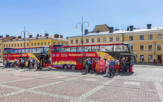 Guests boarding a red double-decker bus during Helsinki Hop-on Hop-off Bus Tour.