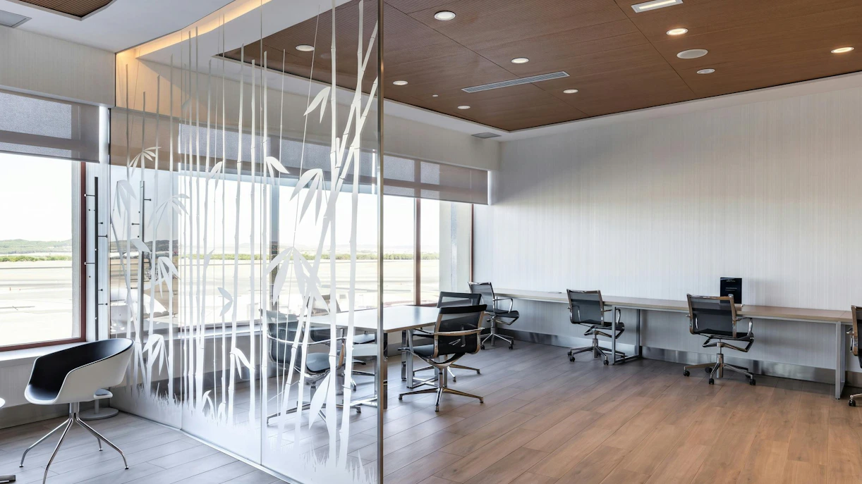 Sala VIP seating area with modern chairs and workstations, Terminal 2, Adolfo Suarez-Barajas Airport, Madrid.