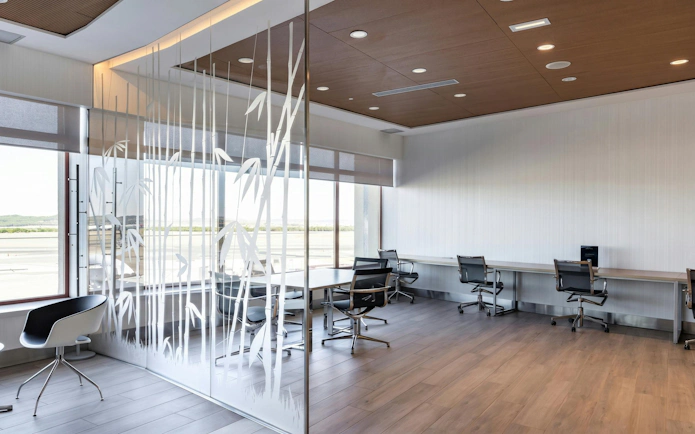 Sala VIP seating area with modern chairs and workstations, Terminal 2, Adolfo Suarez-Barajas Airport, Madrid.