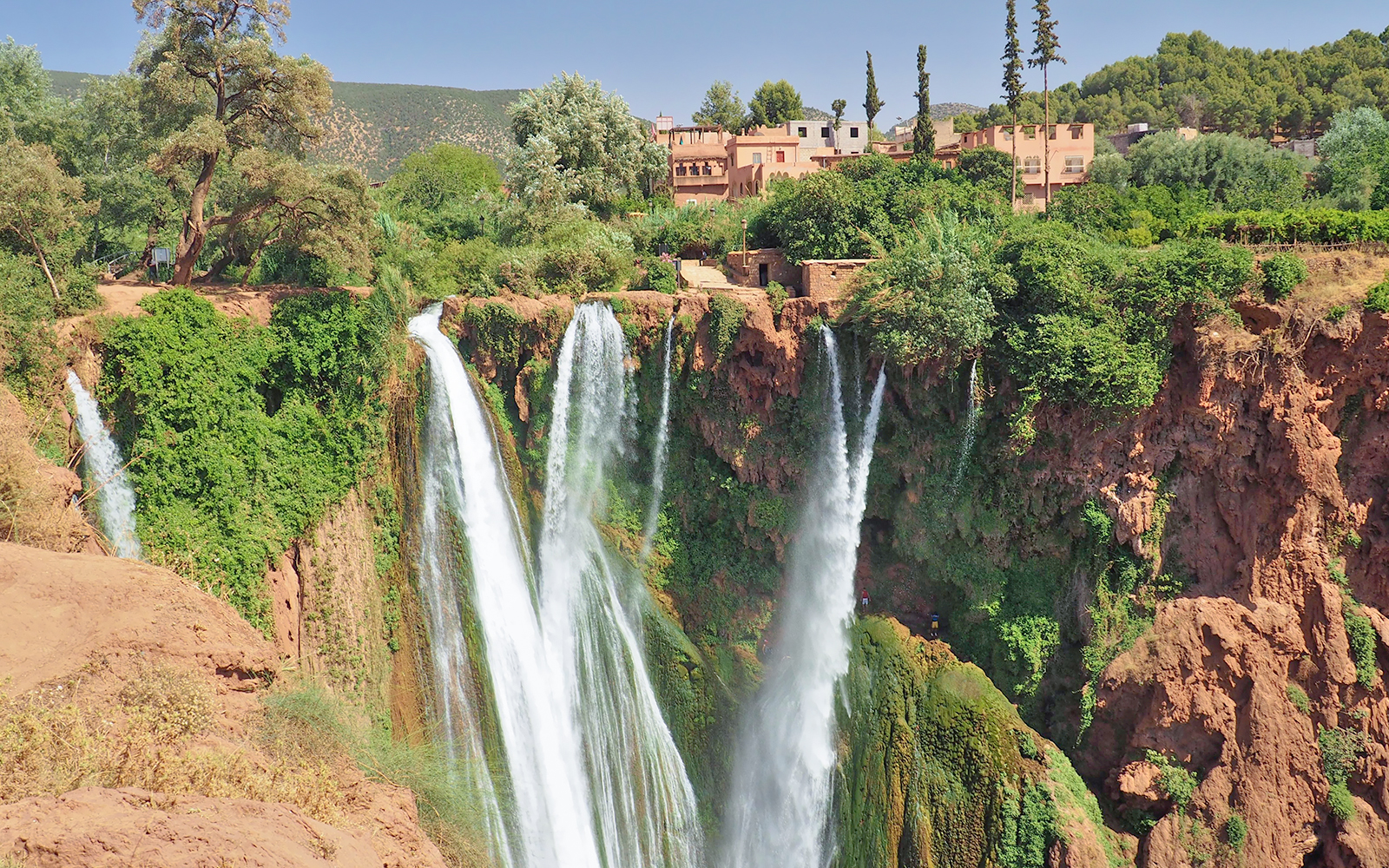 Ouzoud Waterfall in Morocco is an enclave of green and cooling water, popular spot for natives and a destination of one day tourist tours.