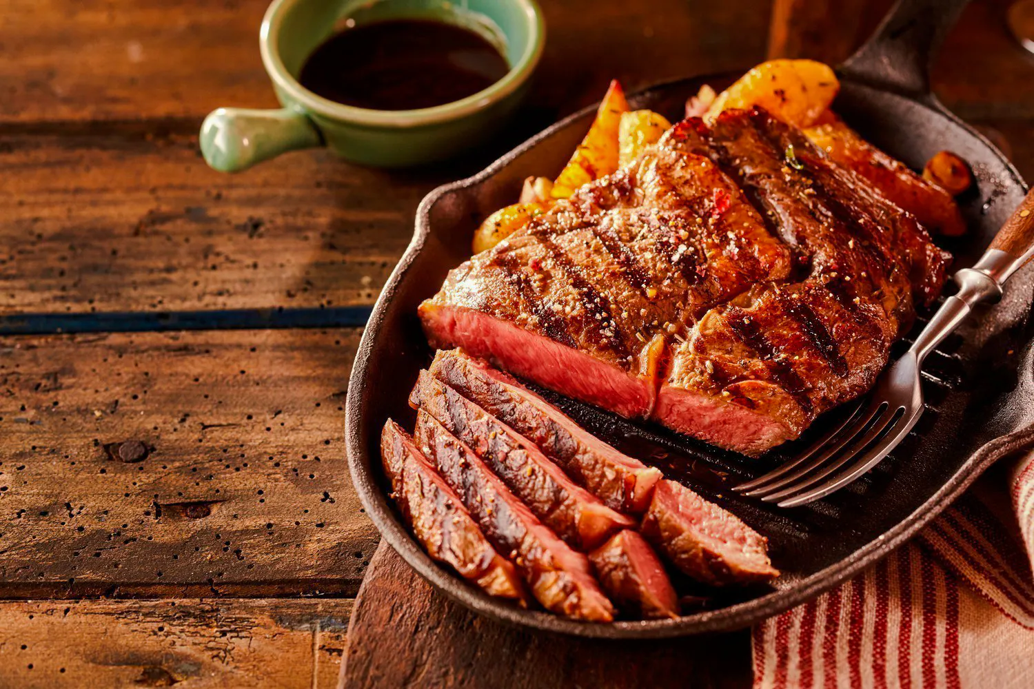 Grilled steak slices on a plate at a Brazilian steakhouse in Rio de Janeiro.