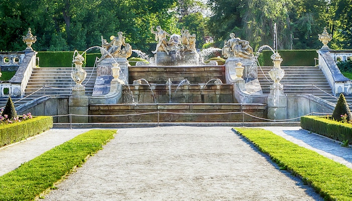 Cesky Krumlov Castle garden with manicured hedges and fountain in the Czech Republic.