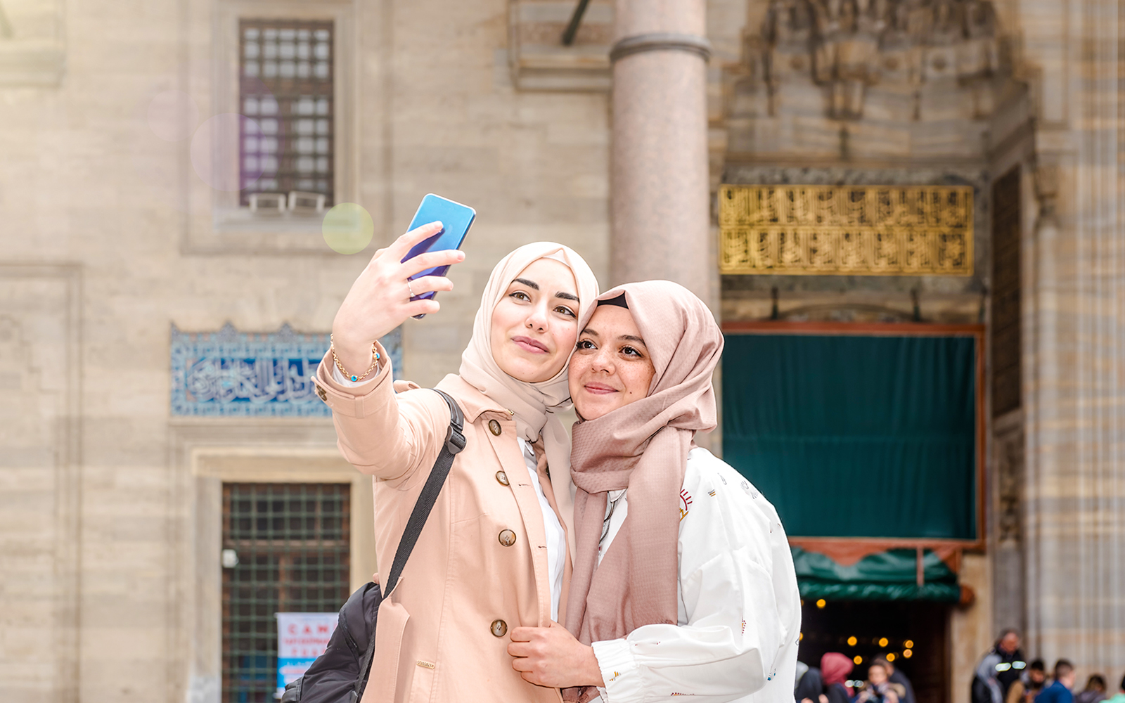 Two women taking a selfie at Sultan Suleymaniye Mosque, Istanbul.