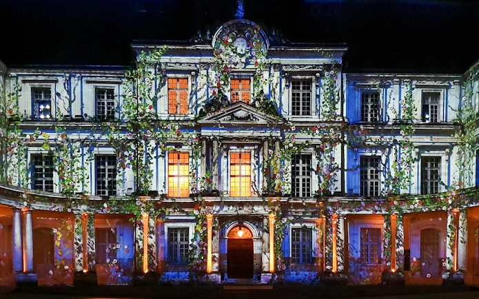 Sound and Light Show at Royal Château of Blois with illuminated facade.
