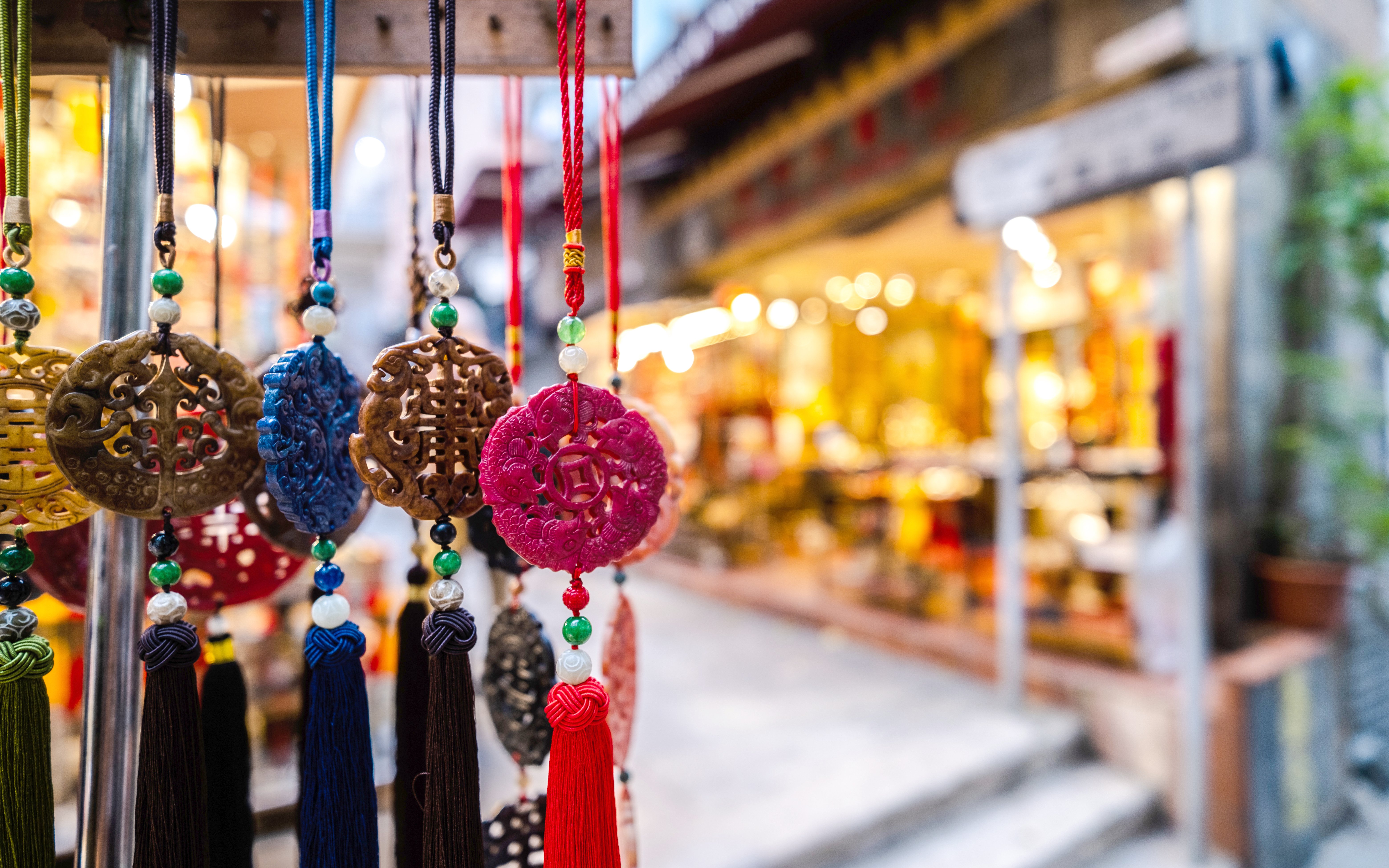 Hanging jade ornaments in a Hong Kong souvenir shop.