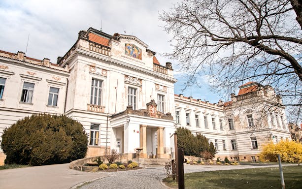 Bohnice Psychiatric Hospital facade in Prague with historical architecture.