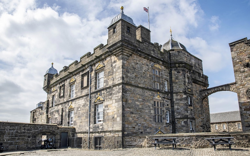 Edinburgh Castle stone facade with archway on guided walking tour.