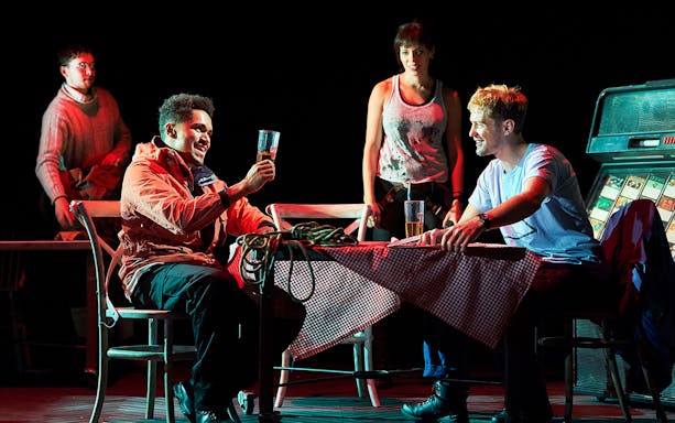 Actors performing a scene from "Touching The Void" on stage.