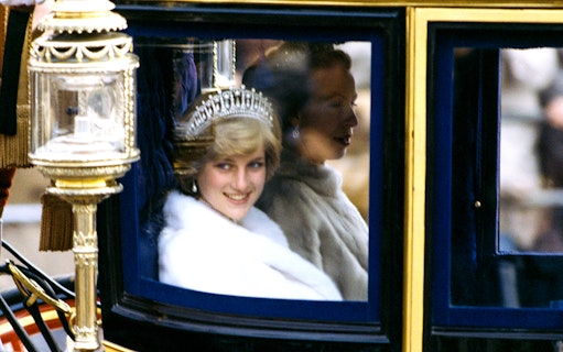 Royal figure in a carriage during a public event, part of the Princess Diana: Accredited Access Photography Exhibition.