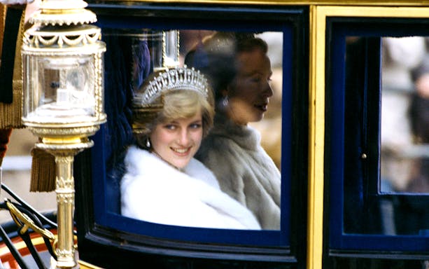 Royal figure in a carriage during a public event, part of the Princess Diana: Accredited Access Photography Exhibition.