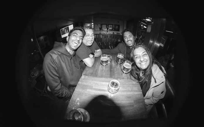 Group enjoying drinks at a bar in Reykjavík during a private bar crawl with a local guide.