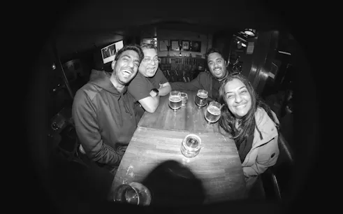 Group enjoying drinks at a bar in Reykjavík during a private bar crawl with a local guide.