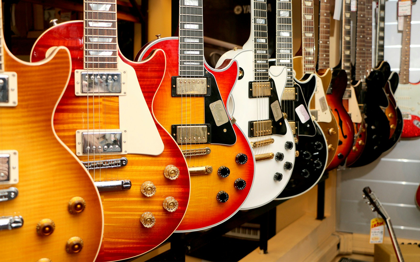 A line up of electric guitats styled differently in Gallery of Iconic Guitars, Nashville.