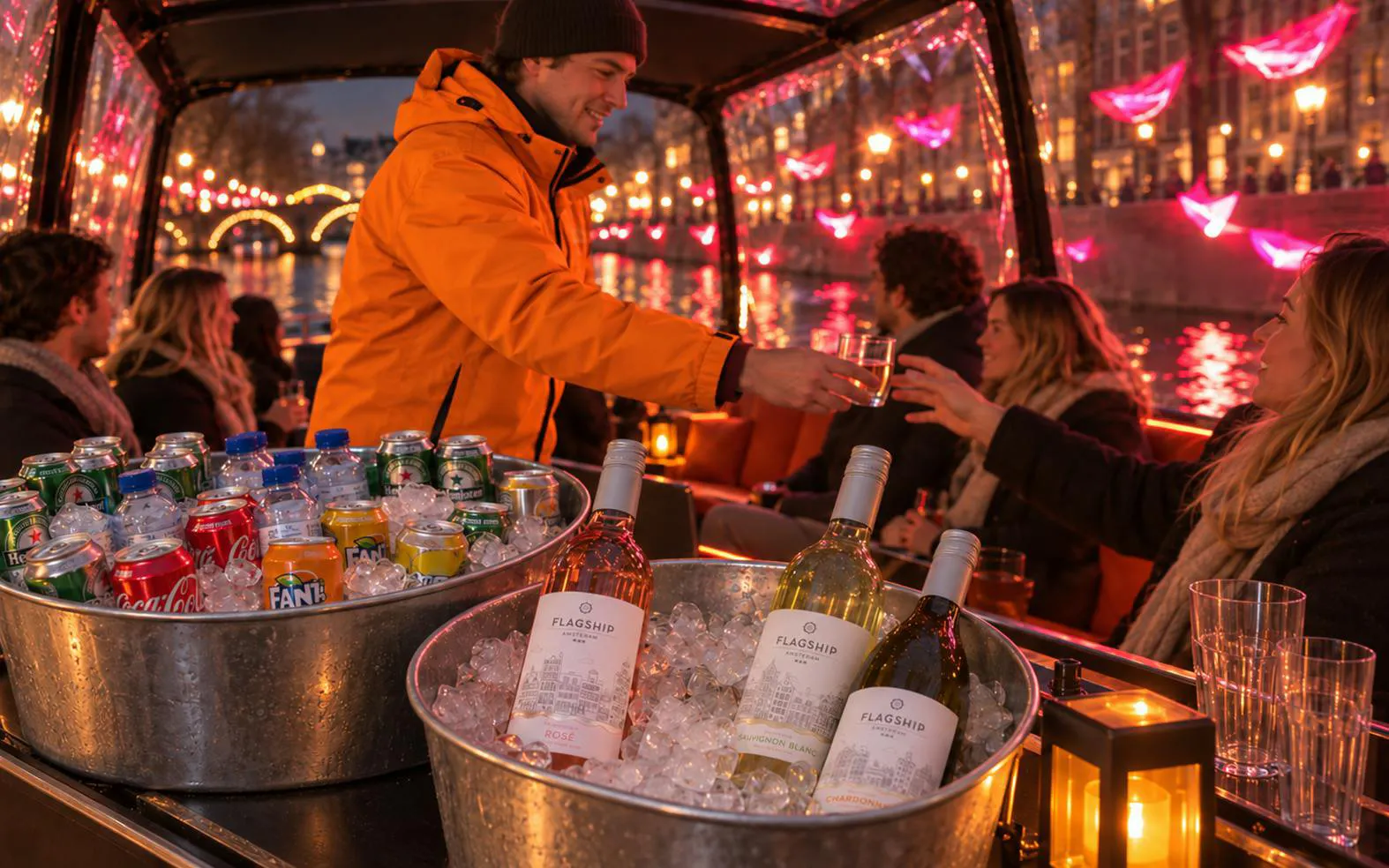 Guests enjoying drinks on an Amsterdam Light Festival canal cruise.