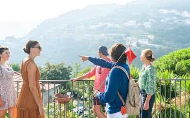 Tour group enjoying scenic view in Positano during guided tour from Sorrento.