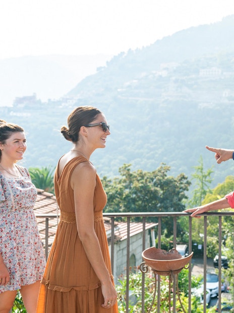 Tour group enjoying scenic view in Positano during guided tour from Sorrento.