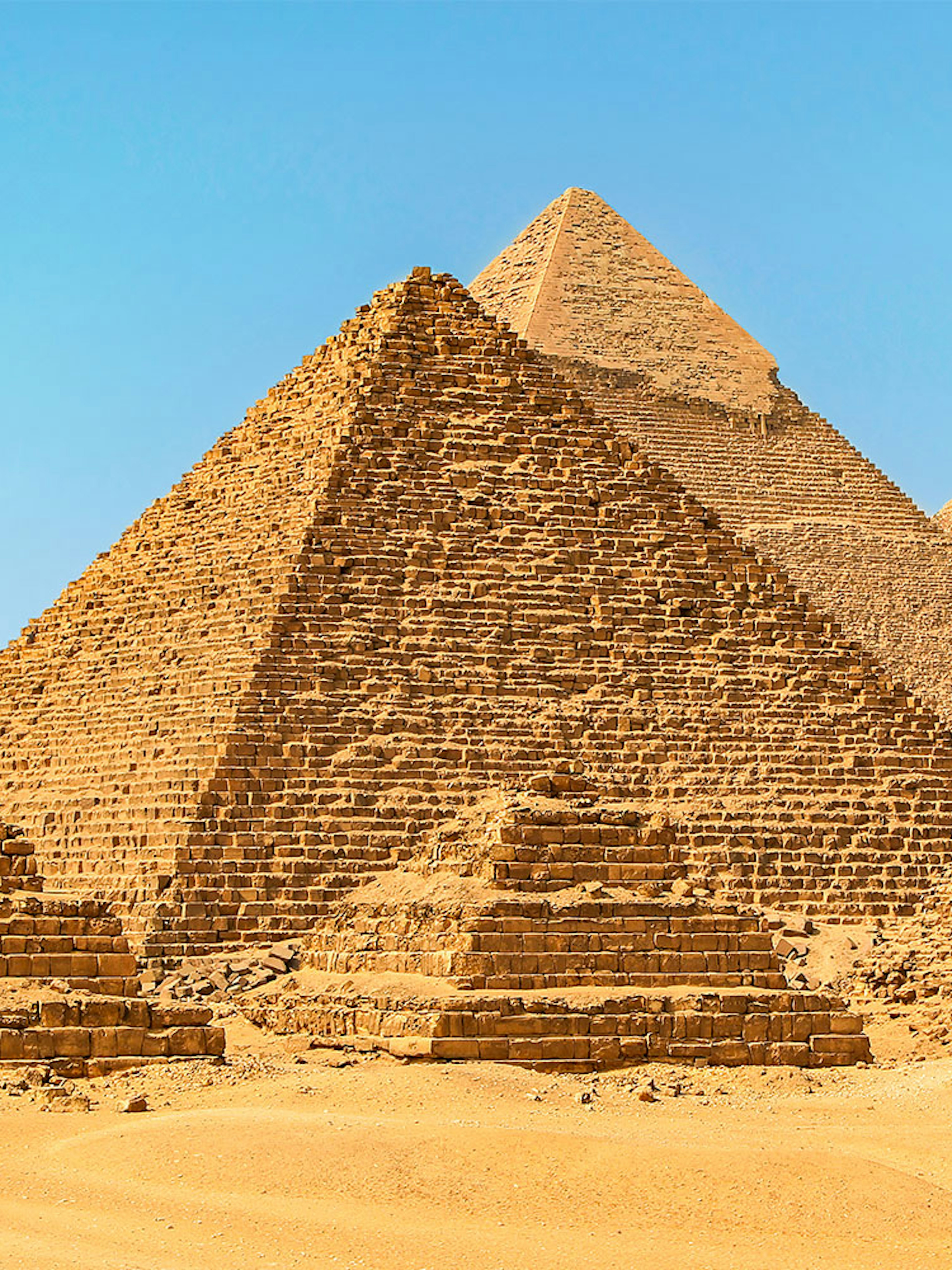 Giza Pyramids under clear blue sky in Egypt.
