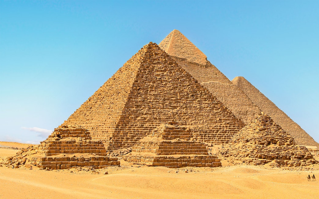 Giza Pyramids under clear blue sky in Egypt.