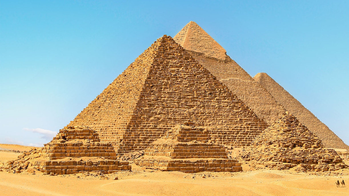 Giza Pyramids under clear blue sky in Egypt.