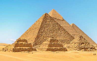 Giza Pyramids under clear blue sky in Egypt.