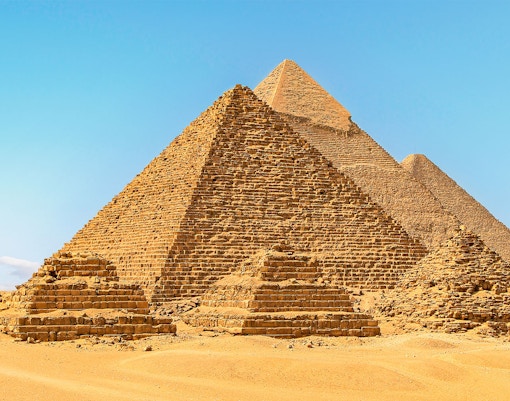 Giza Pyramids under clear blue sky in Egypt.