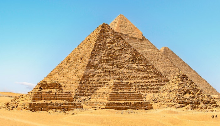 Giza Pyramids under clear blue sky in Egypt.