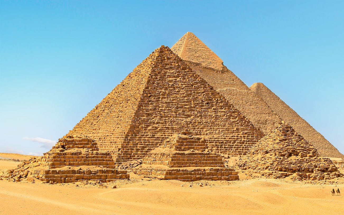 Giza Pyramids under clear blue sky in Egypt.