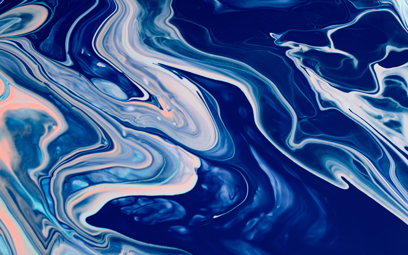 Drip paiting action with blue paints on canvas