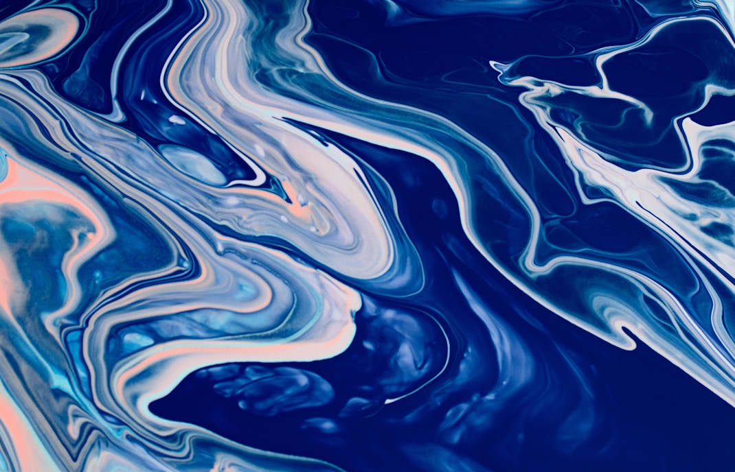 Drip paiting action with blue paints on canvas