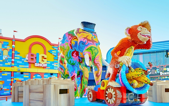 Colorful Lego elephant and monkey sculptures at Legoland Japan entrance.