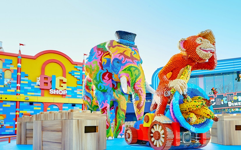 Colorful Lego elephant and monkey sculptures at Legoland Japan entrance.