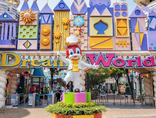 Dream World entrance with colorful architecture and character statue, Bangkok.