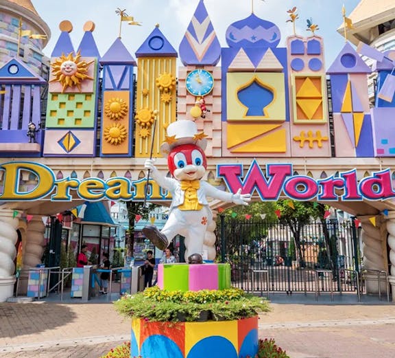Dream World entrance with colorful architecture and character statue, Bangkok.