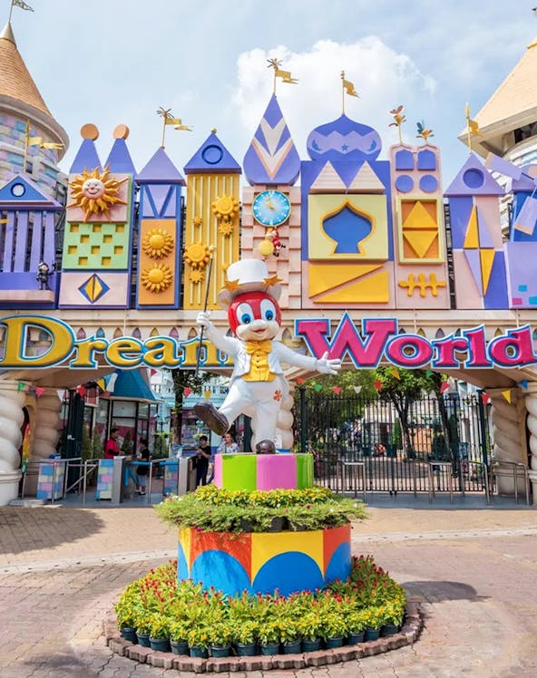 Dream World entrance with colorful architecture and character statue, Bangkok.
