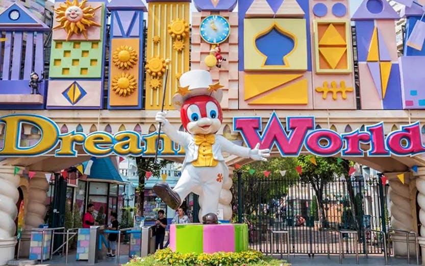 Dream World entrance with colorful architecture and character statue, Bangkok.