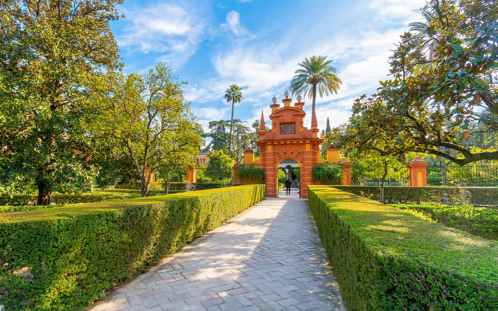 The ornate landscaped grounds and gardens inside the Royal Alcázar of Seville, a 10th century palace in the historic center of Seville, Spain