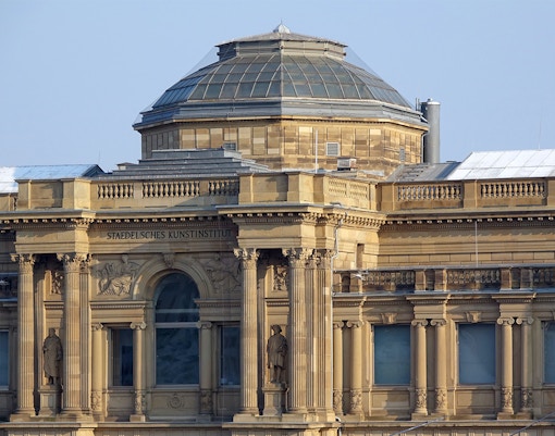 Städel Museum's neoclassical facade with dome in Frankfurt, Germany.