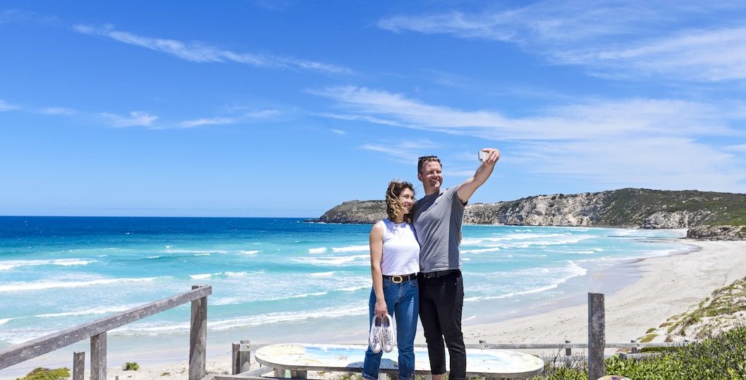 Couple taking a selfie on a boardwalk overlooking the beach at Kangaroo Island.